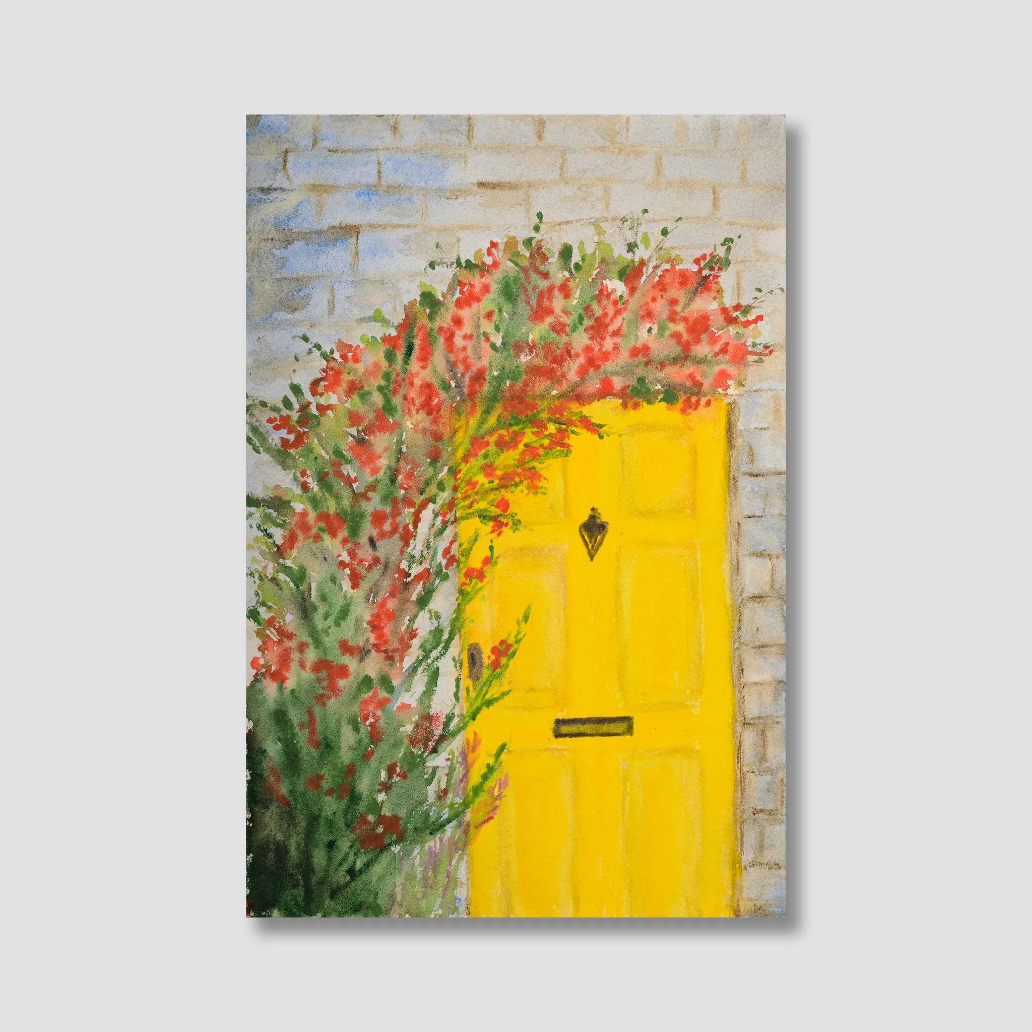 Painting of a yellow door with floral decorations on a stone wall.